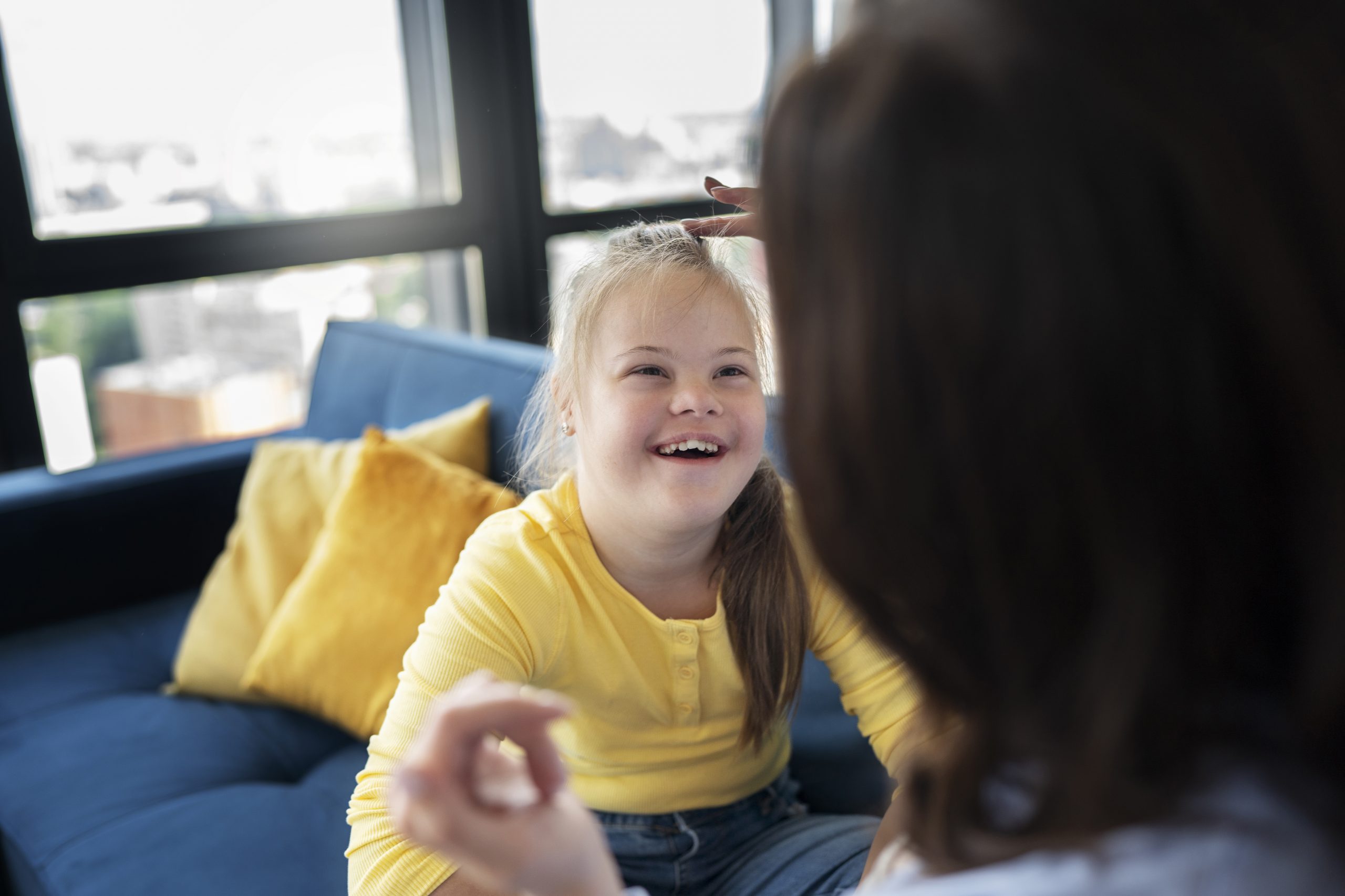 high-angle-smiley-girl-with-down-syndrome